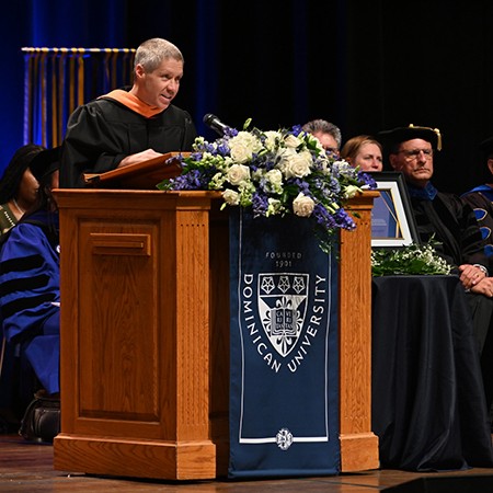 Professor at Commencement podium