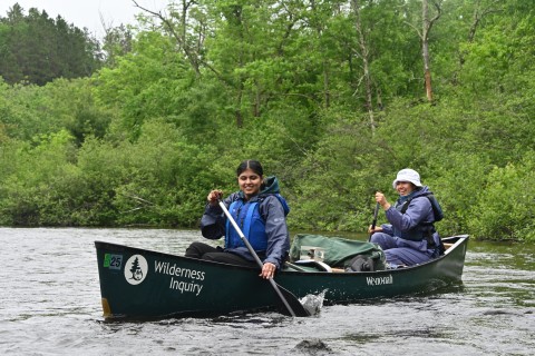 Two students on a rowboar