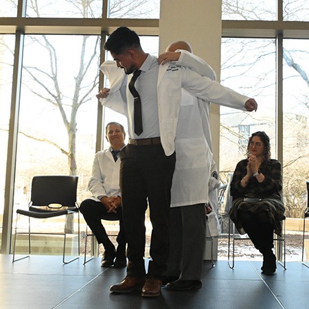 PA student ceremony receiving white coat
