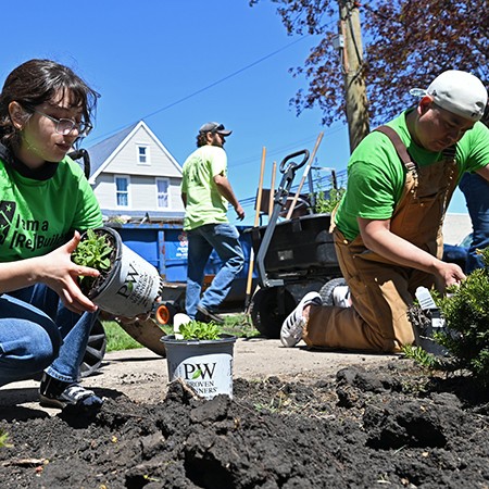 Students planting flowers