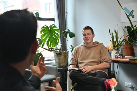 Student seated with mentor