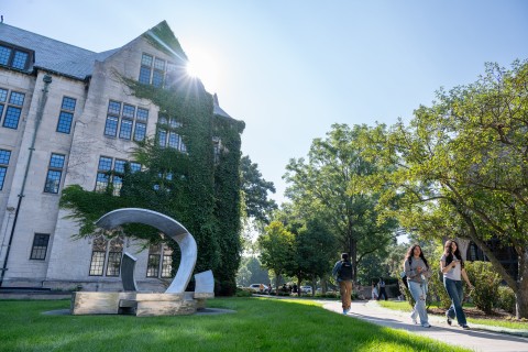 Two students walking on campus