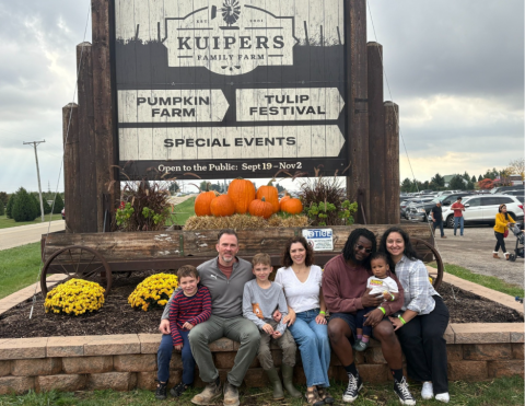 People sitting at the Kuipers Family Farm entrance.