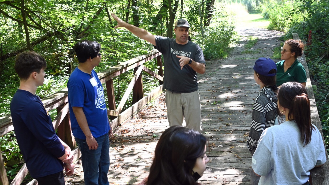 Students and faculty in outdoor setting