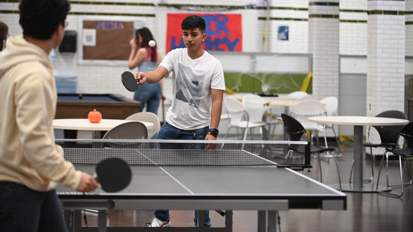 Students playing table tennis