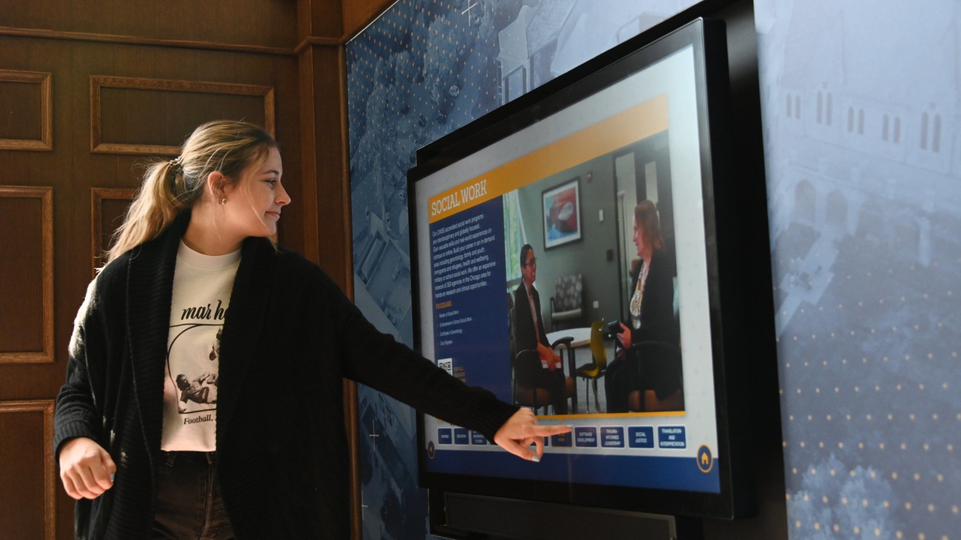 Welcome Center with Student at Video Screen