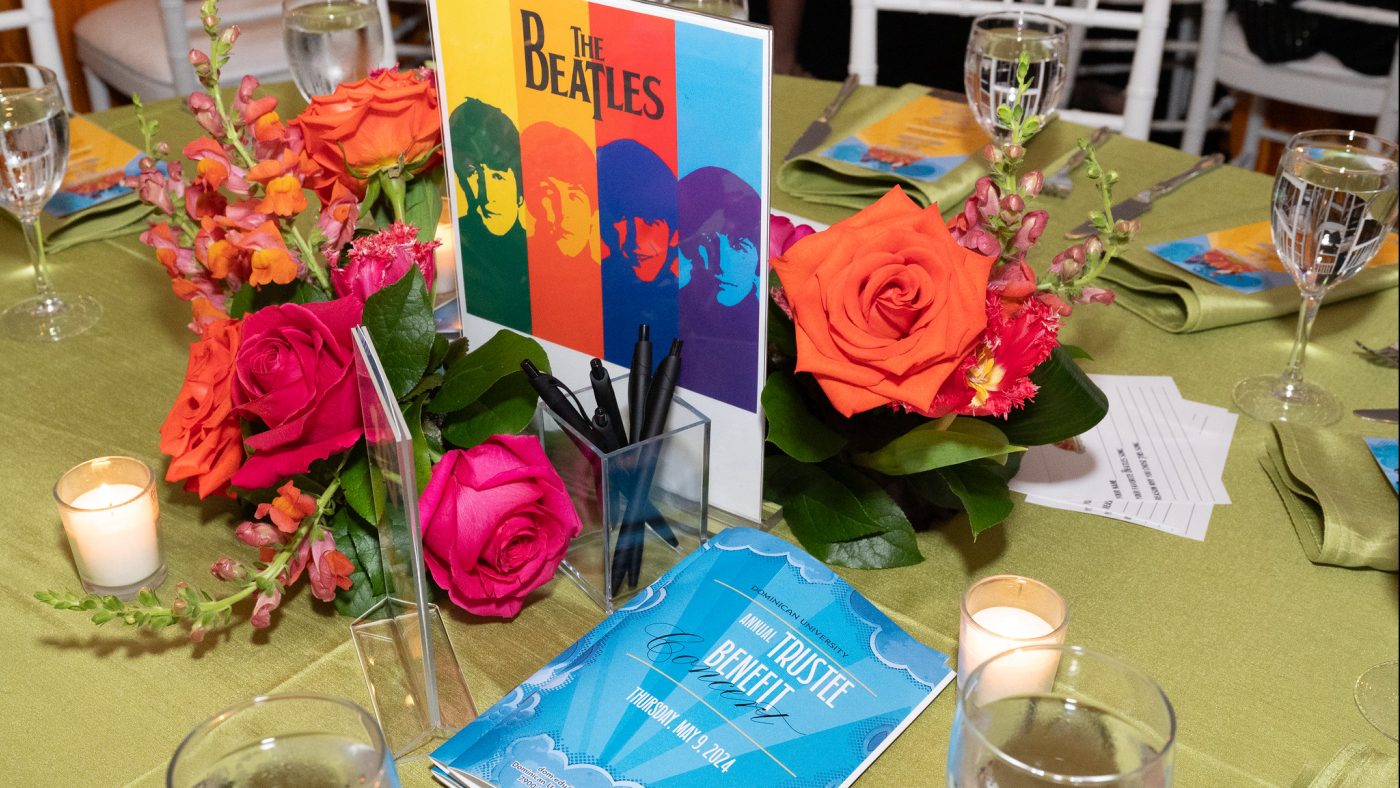 Table with flowers, candles and flyers