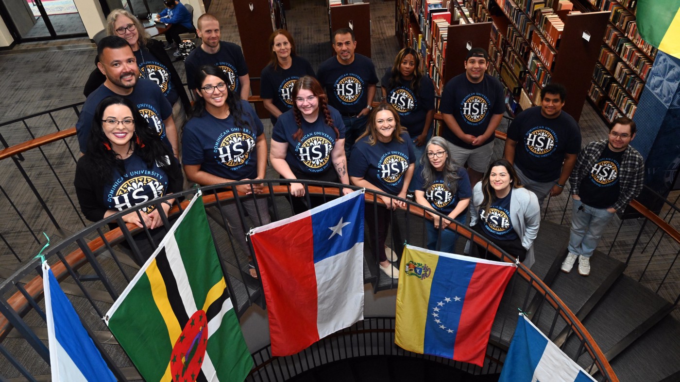 Multiple students in staircase with HSI t-shirts