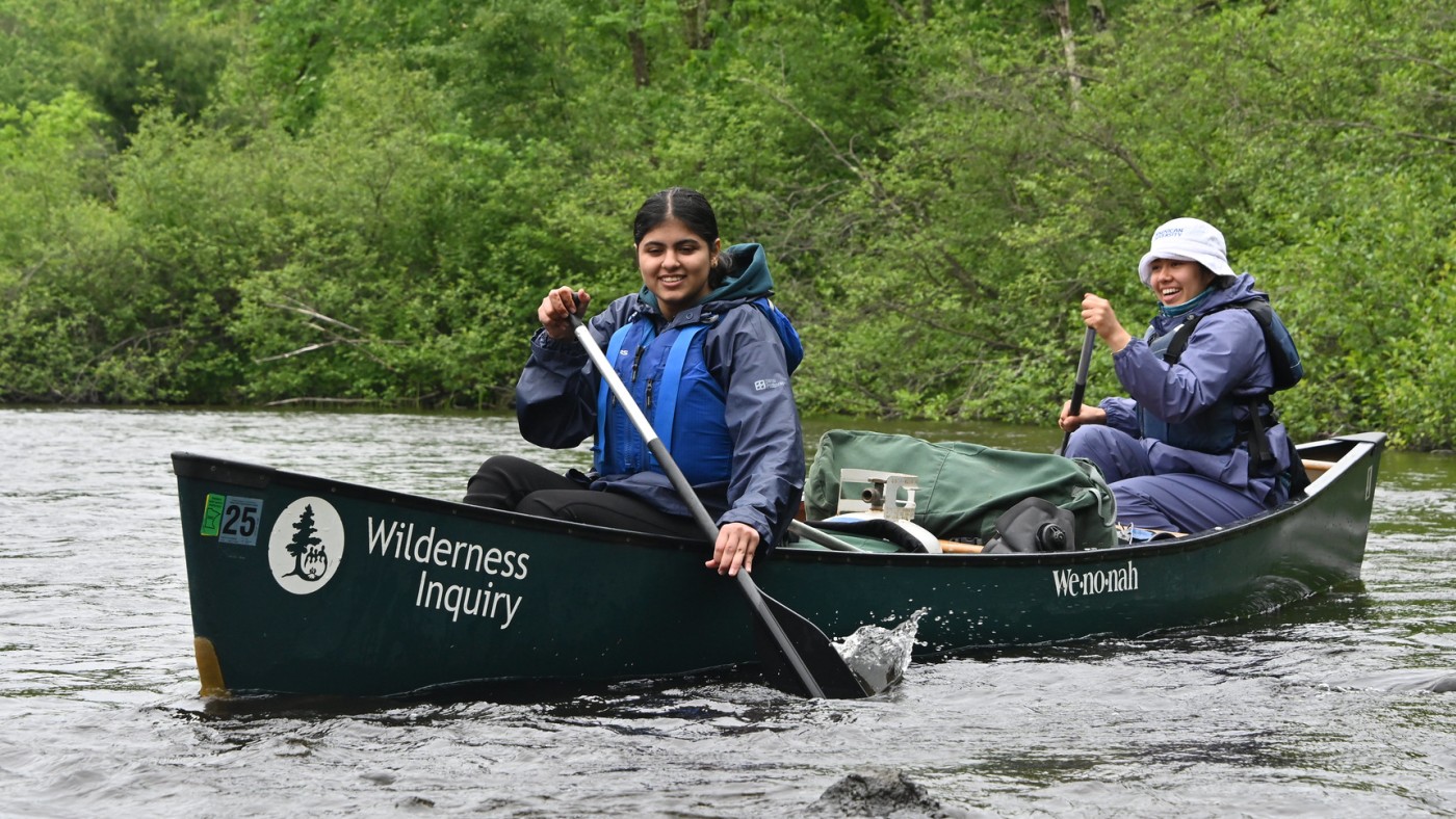 Two students on a rowboar