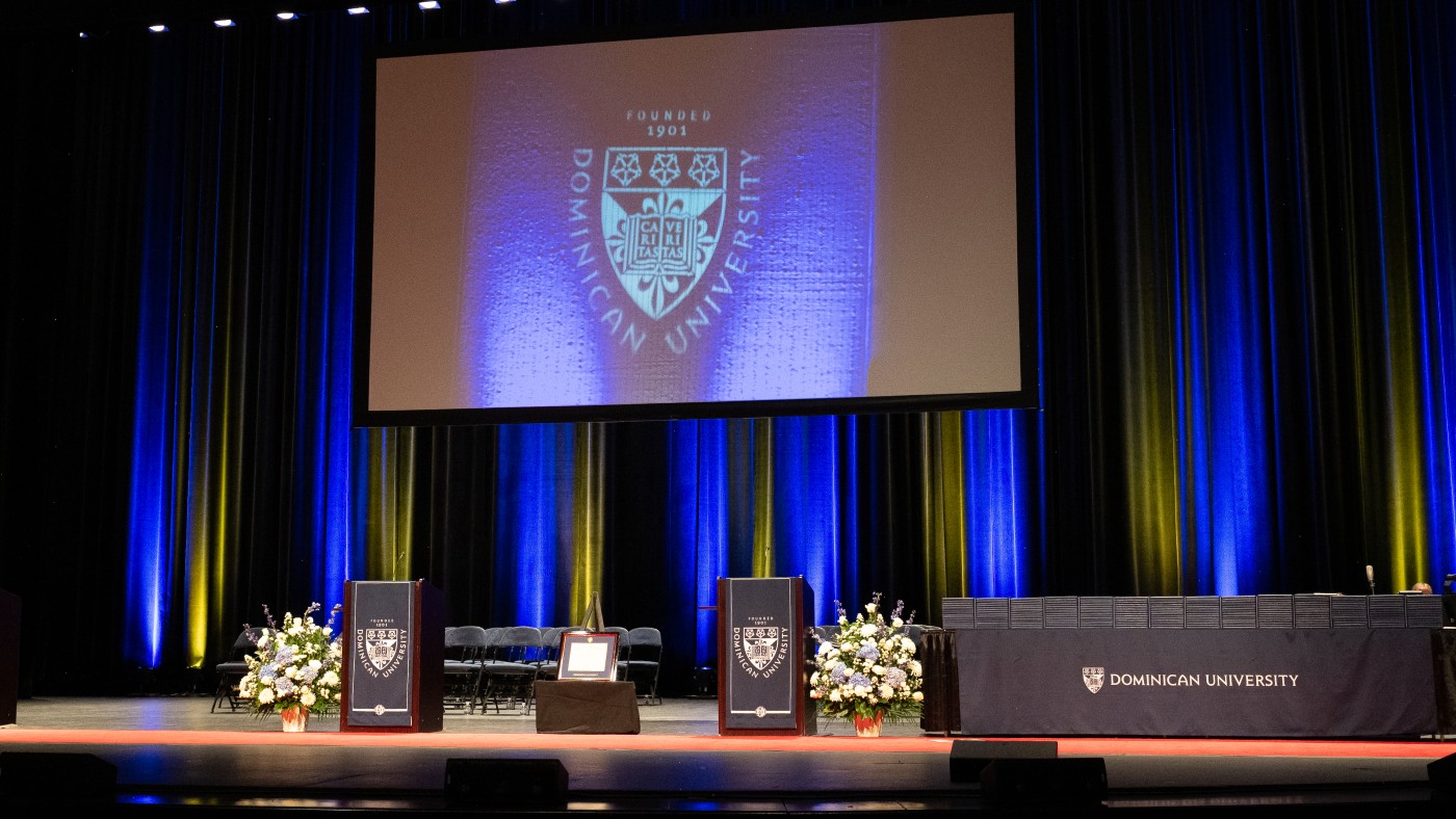 The stage is set at Rosemont Theatre for Dominican University's Spring Commencement ceremonies.