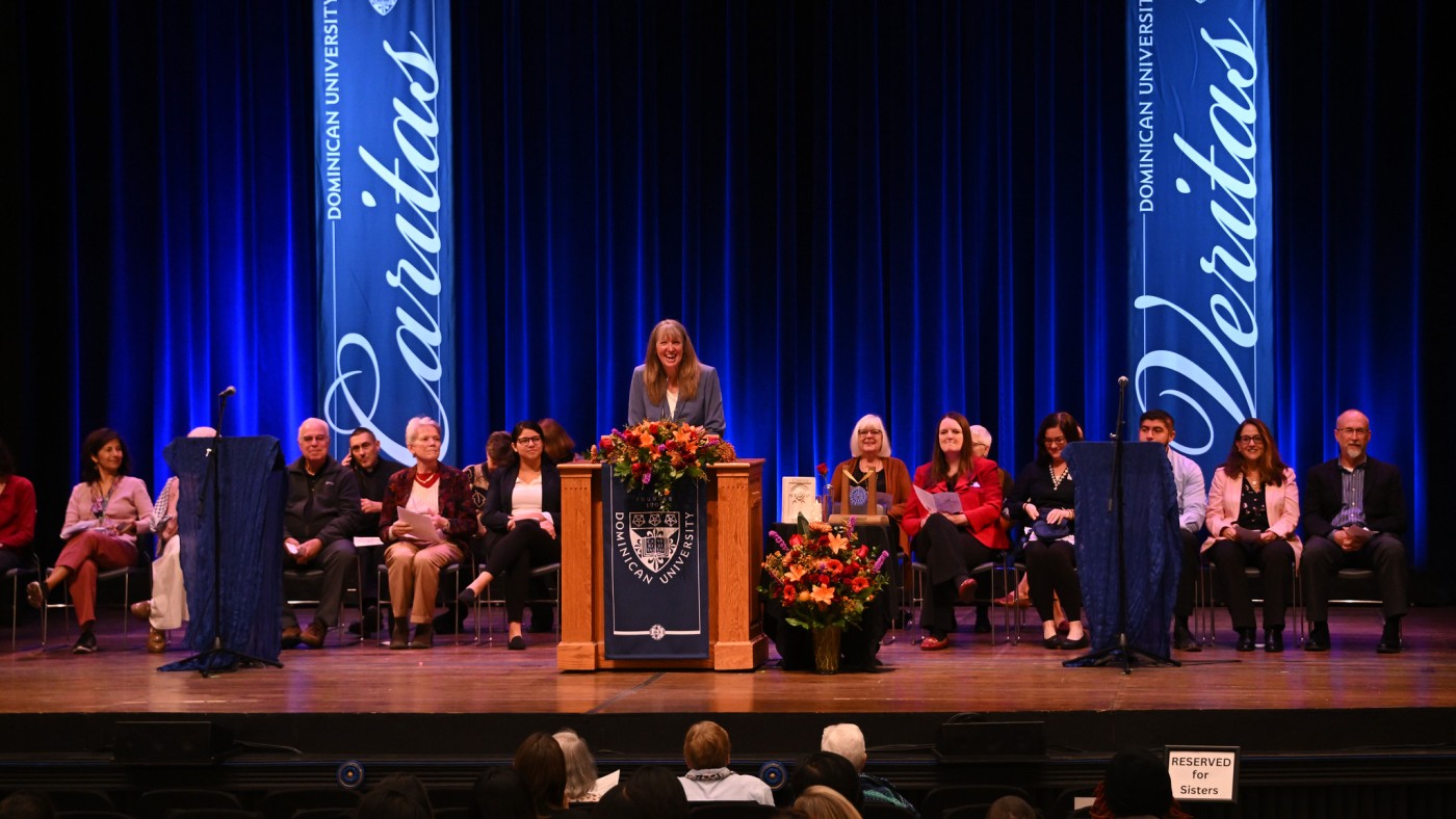 Individuals on stage in Lund Auditorium