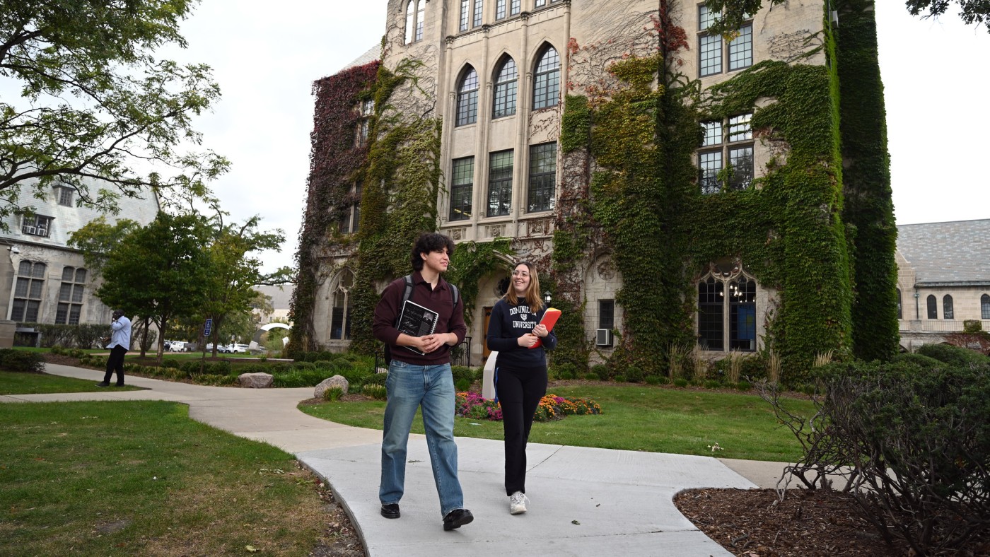 Students walkng in front of Lewis Hall