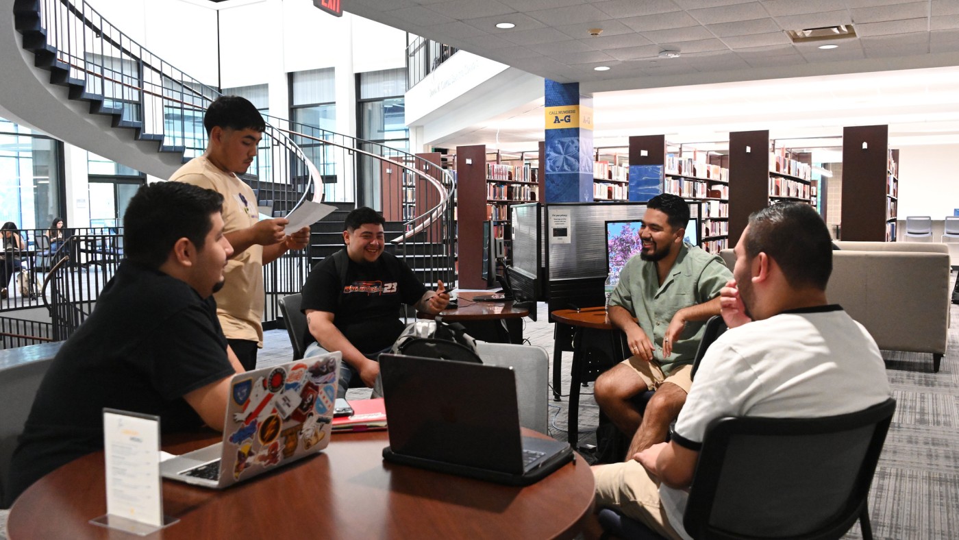 Students at a table in the library