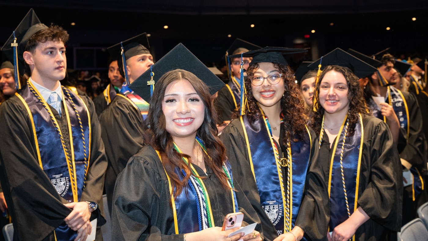 Students in commencement caps and gowns 