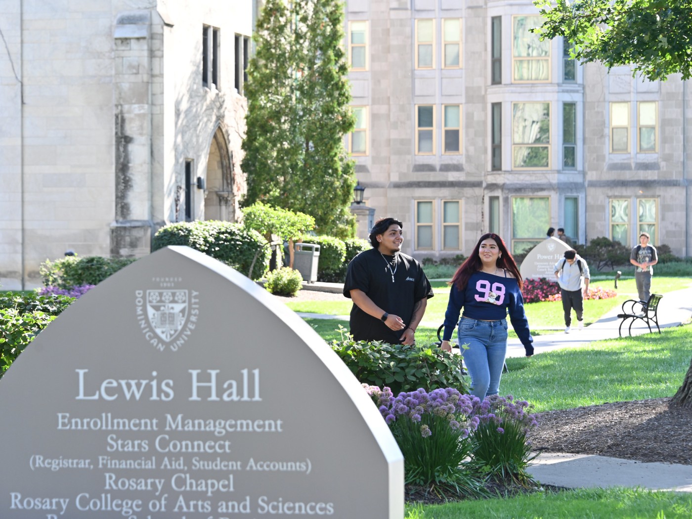 Two students in front of Lewis Hall