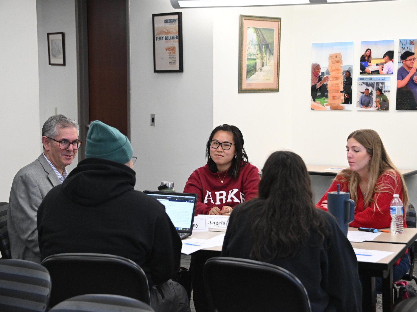 Students and faculty at table
