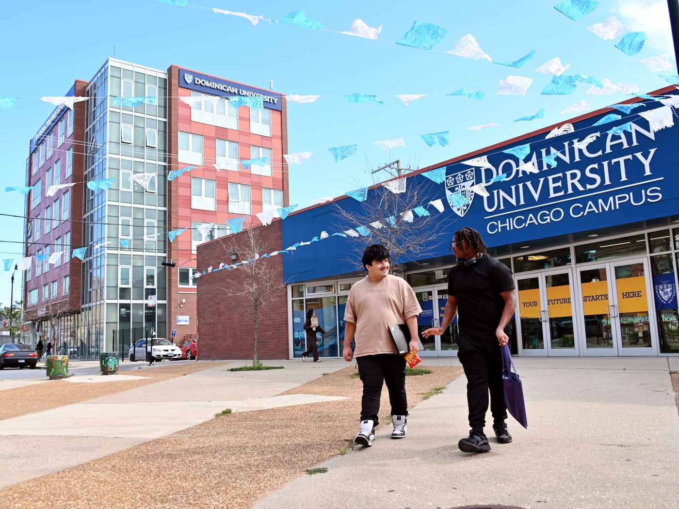 Two male students on Chicago campus sidewalk