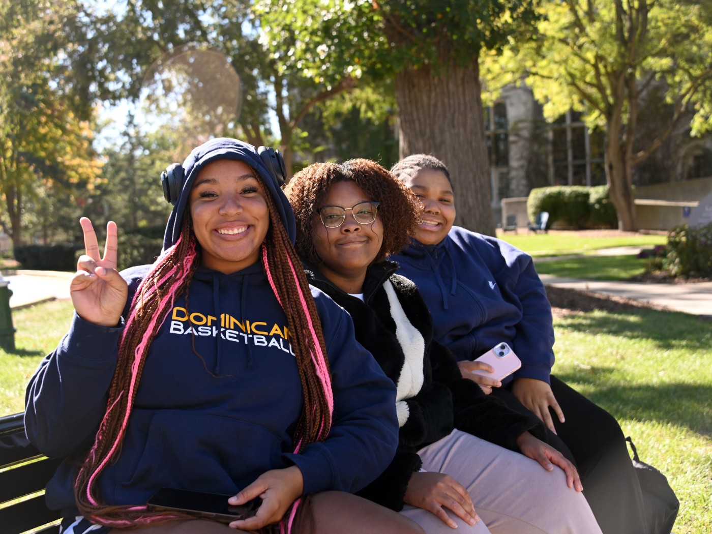 Three female students on a bench
