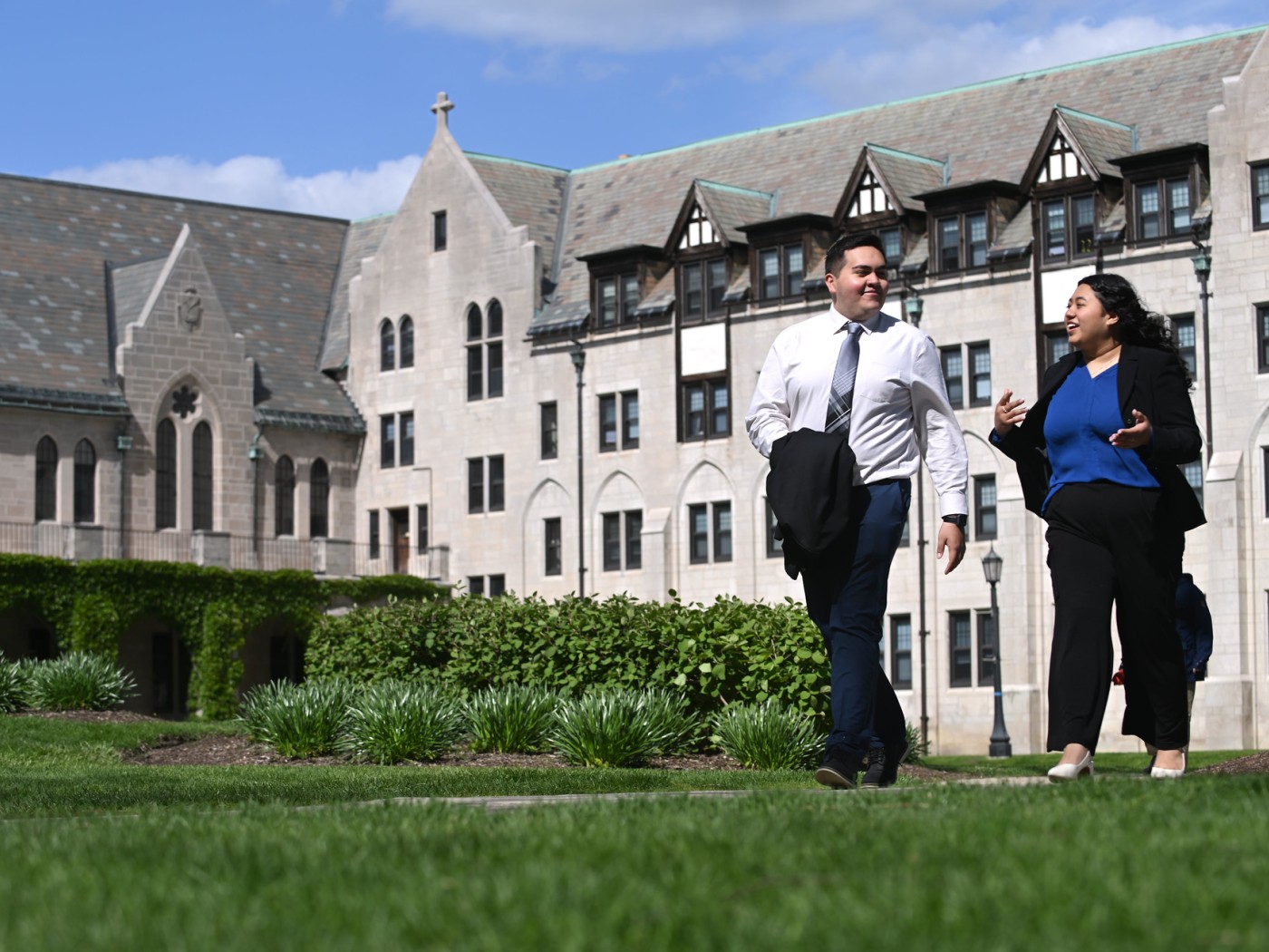 Professionally dressed students walking on campus