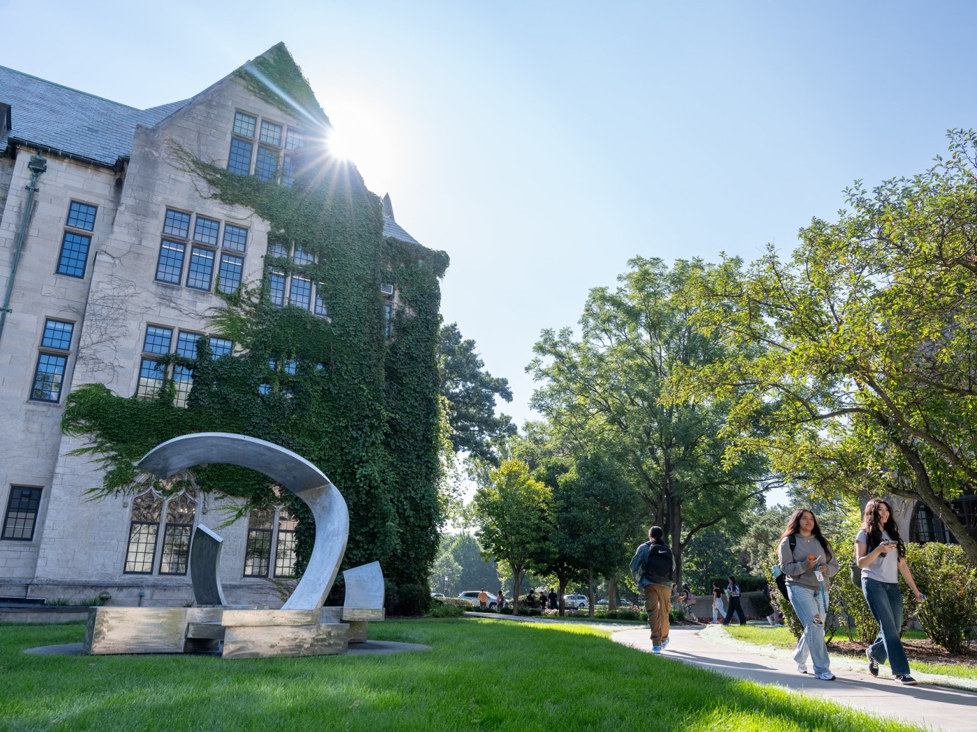 Two students walking on campus