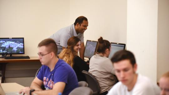 instructor and students in computer lab