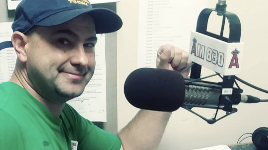 Brigham Avery at the microphone