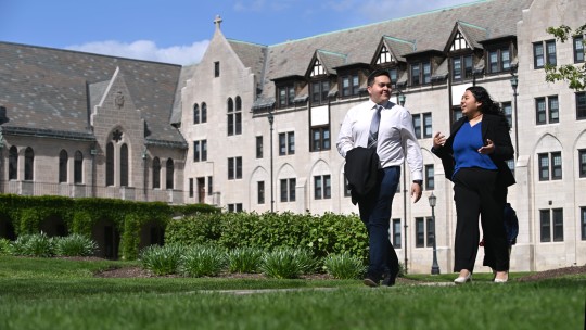 Professionally dressed students walking on campus